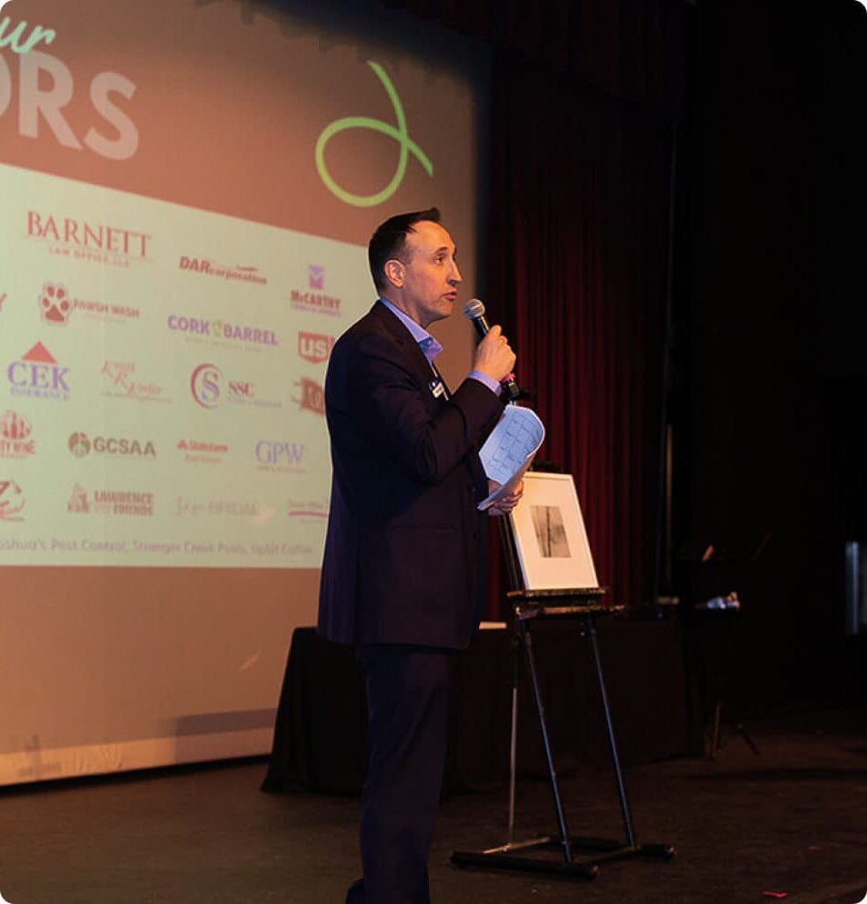 John emcees an event